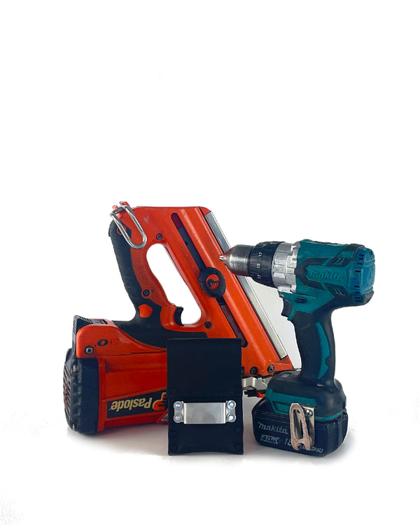 An image of a nail gun, a drill, and a black leather drill clip against a white background.